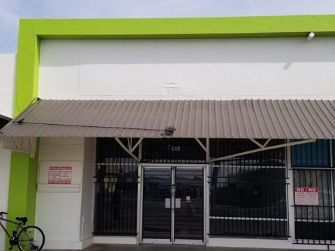 the front of a building with a bike parked outside