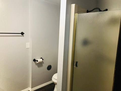 a small bathroom with a toilet and a shower