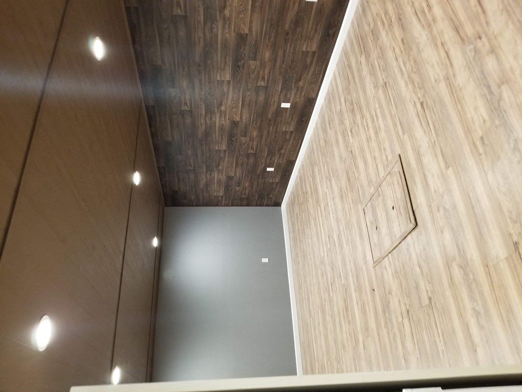 a view of the ceiling in a room with wood paneling