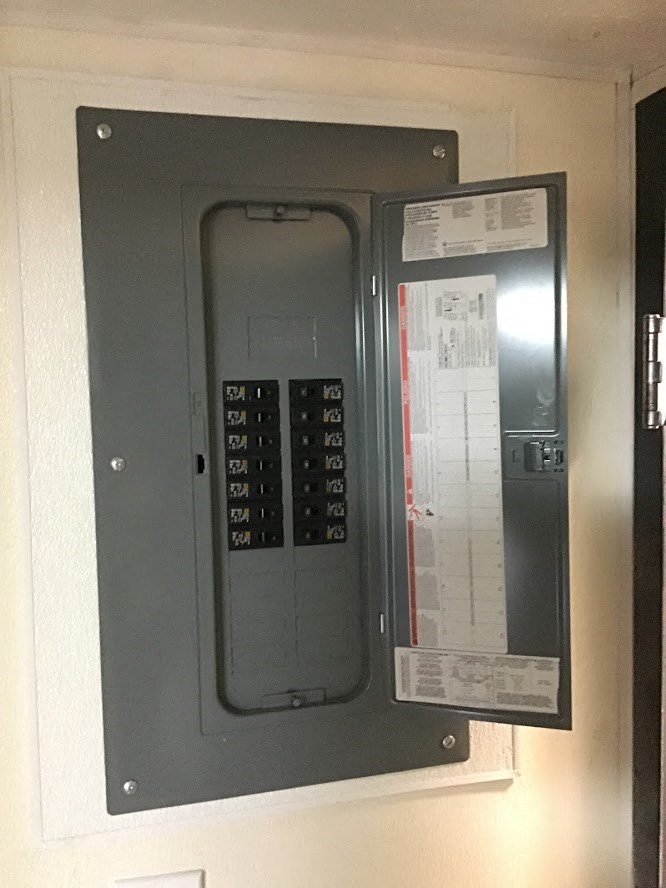 a door with a control panel on the wall
