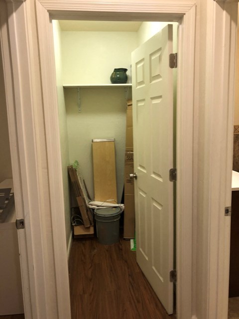the bathroom is being remodeled and the door is open to the closet
