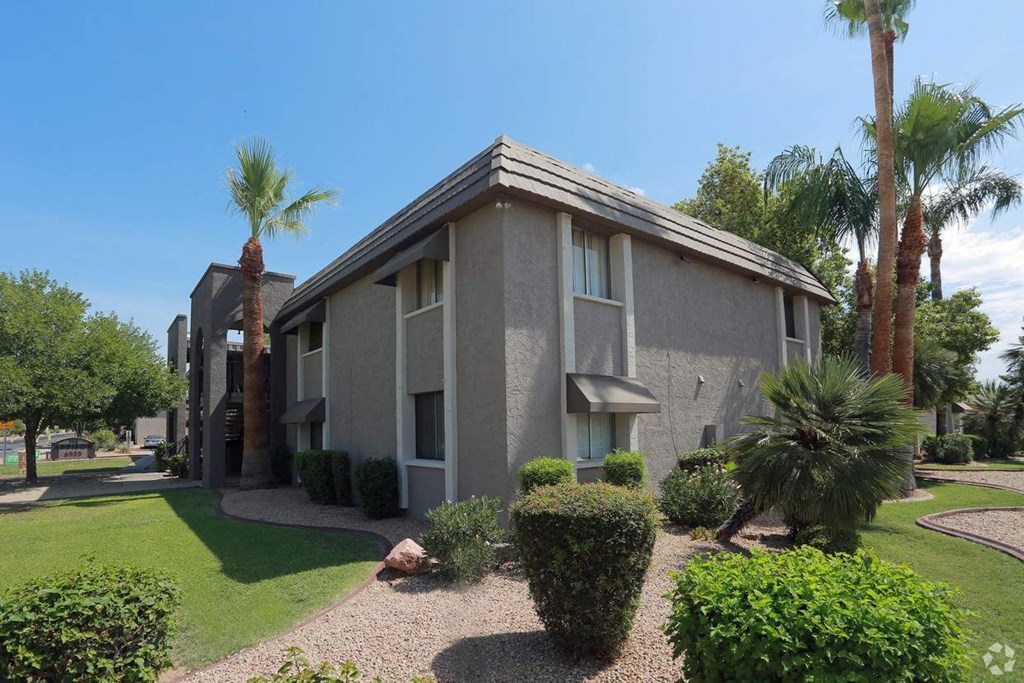 a building with palm trees in front of it