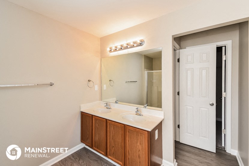a bathroom with a white sink and a mirror