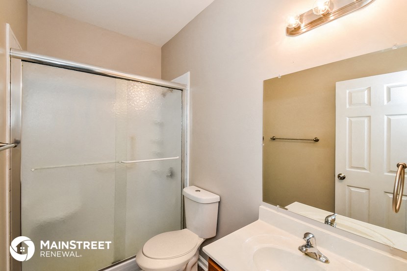 a bathroom with a sink toilet and a shower