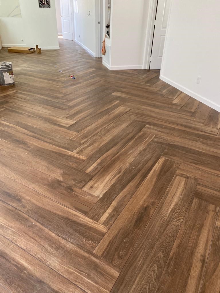 a hardwood floor in a room with a wooden floor