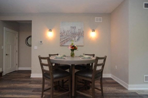 a dining room with a table and chairs