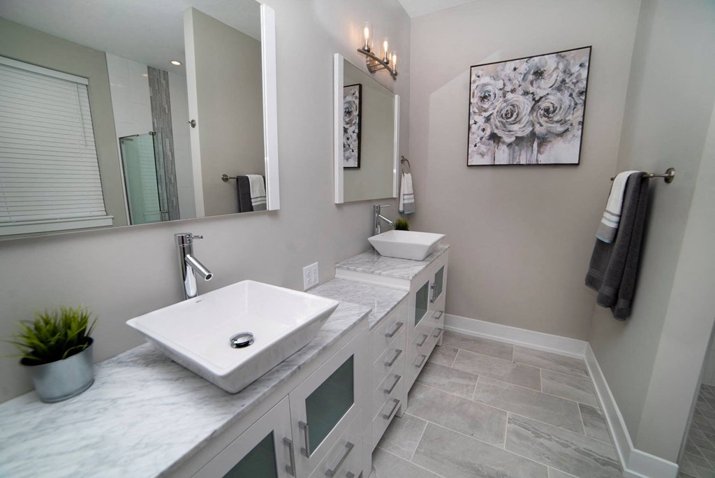 a bathroom with a sink and a mirror