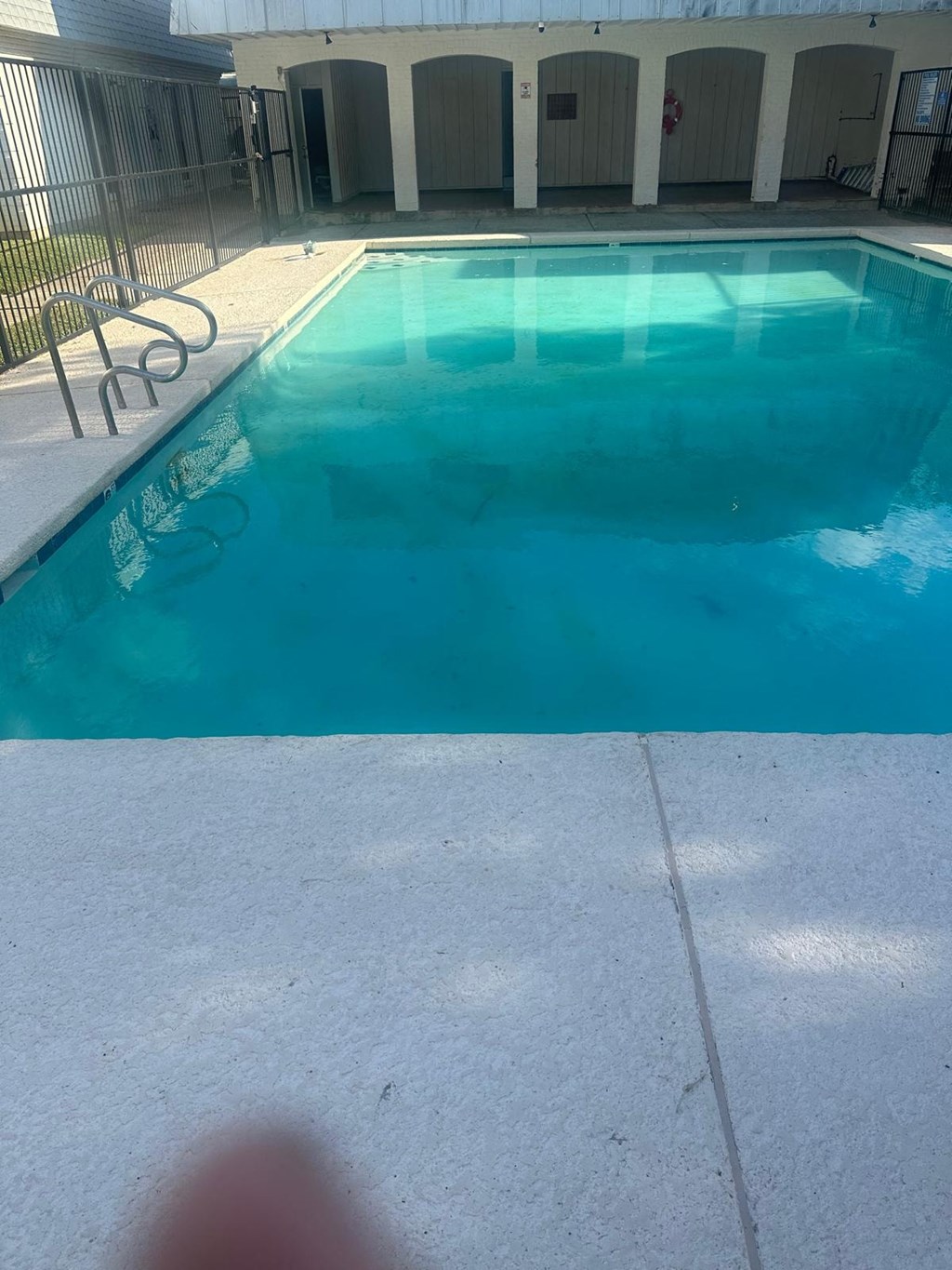 a large pool of blue water in a swimming pool