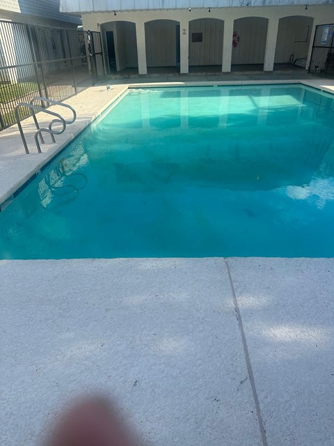 a large pool of blue water in a swimming pool