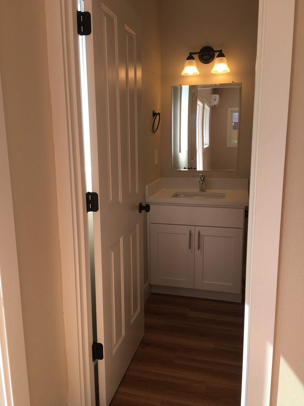 a small bathroom with a sink and a mirror