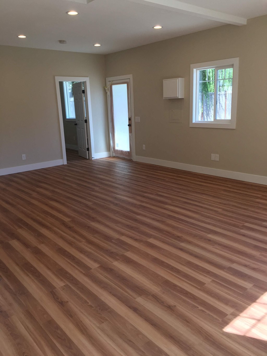 a living room with a hard wood floor