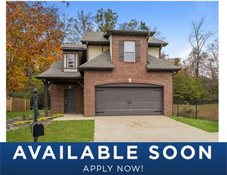 a updated house with a garage door and a possibleiable soon sign