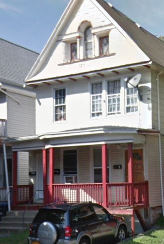 a house with a car parked in front of it
