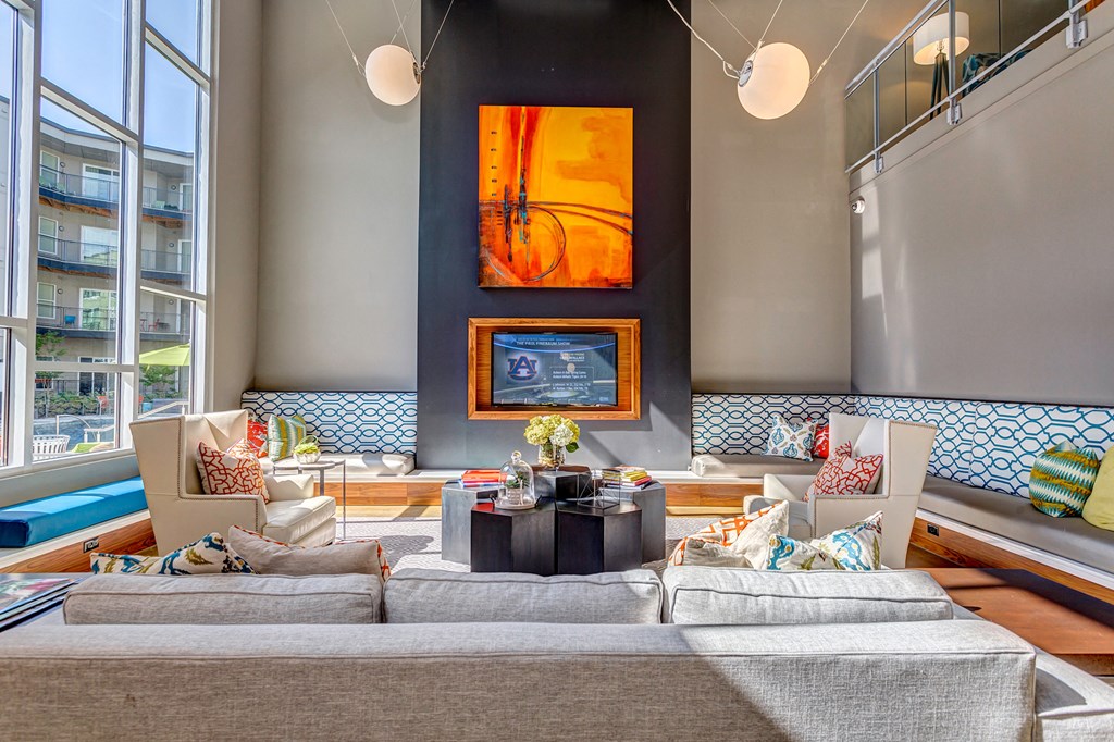 a living room with a large couch and a fireplace