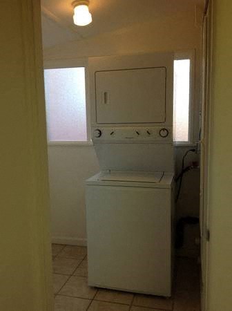 a washing machine and dryer in a small room