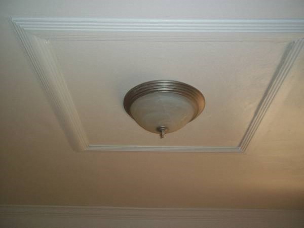 a light fixture on the ceiling of a room