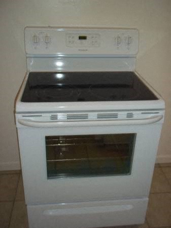 a white stove and oven in a kitchen