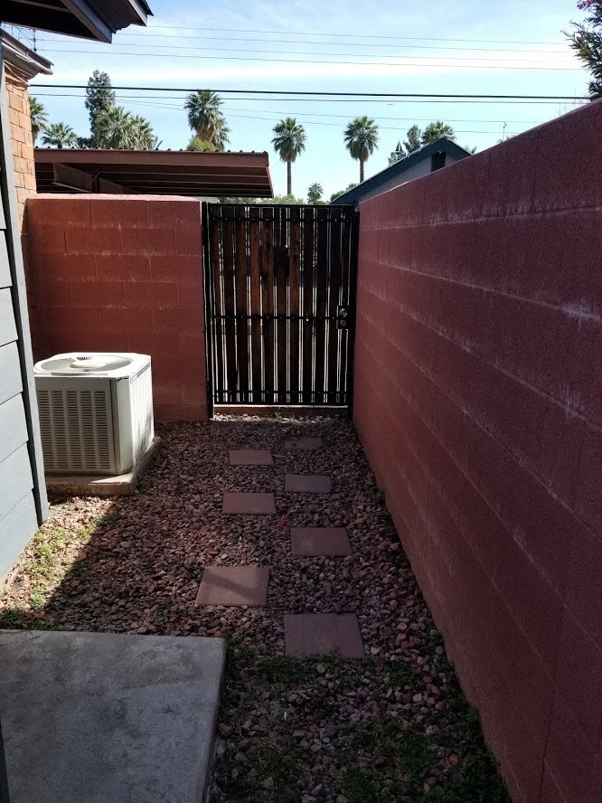 a side view of a fence with a heater next to it