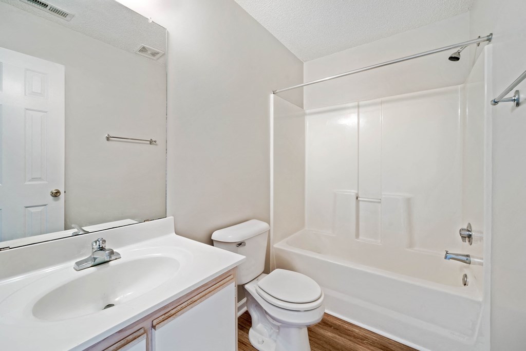 a bathroom with a sink toilet and a shower