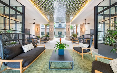a living room with couches and chairs and a coffee table