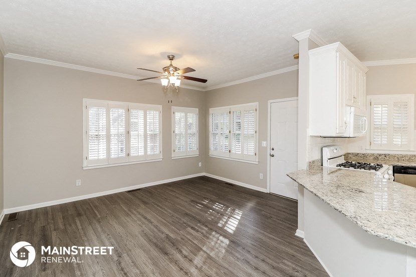 the living room and kitchen of a 560 sq ft home