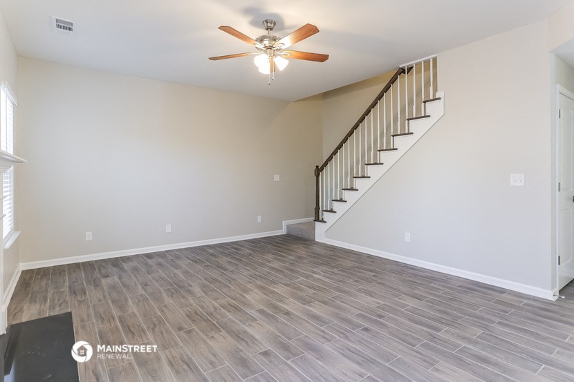 the spacious living room with stairs to the loft