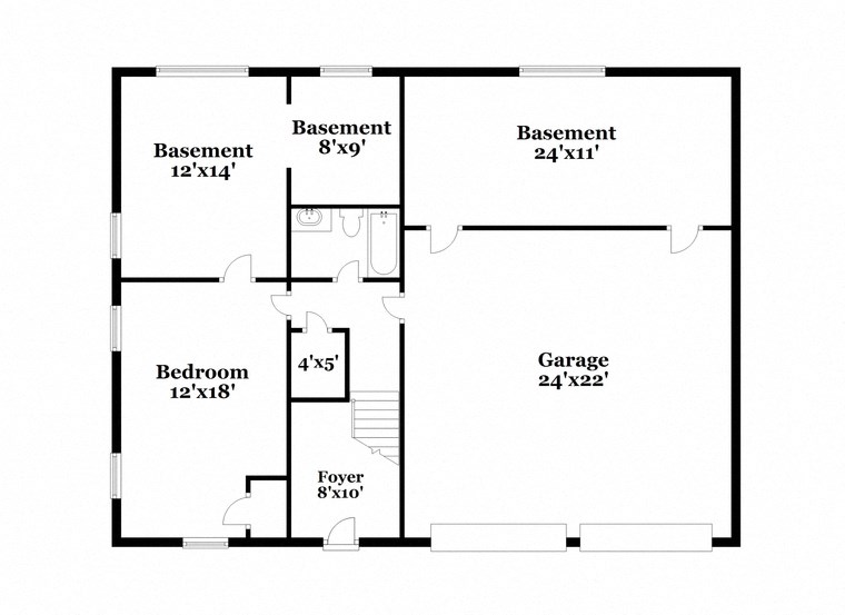 floor plan of the first floor of a house with a bedroom and a bathroom