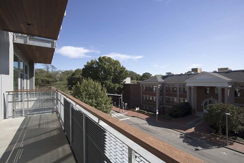 A view of a building with a walkway in front of it.