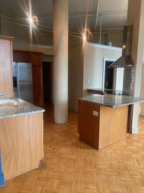 an empty kitchen with an island in the middle of it