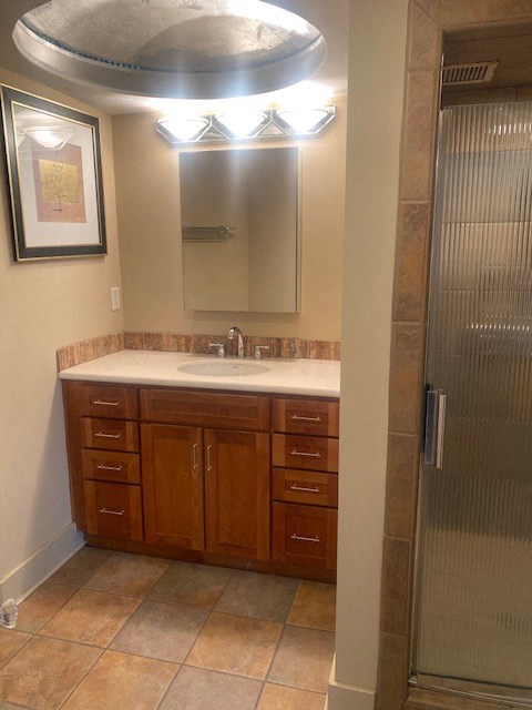 a bathroom with a sink and a shower