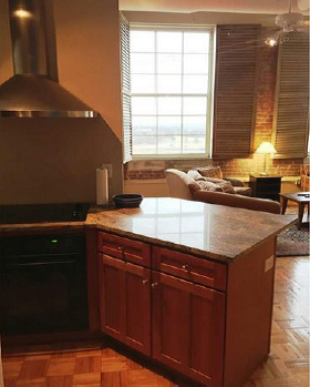 a kitchen with a stove and a counter top
