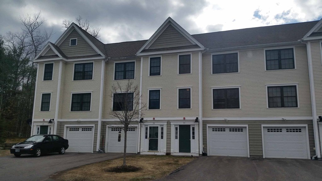 a house with a car parked in front of it