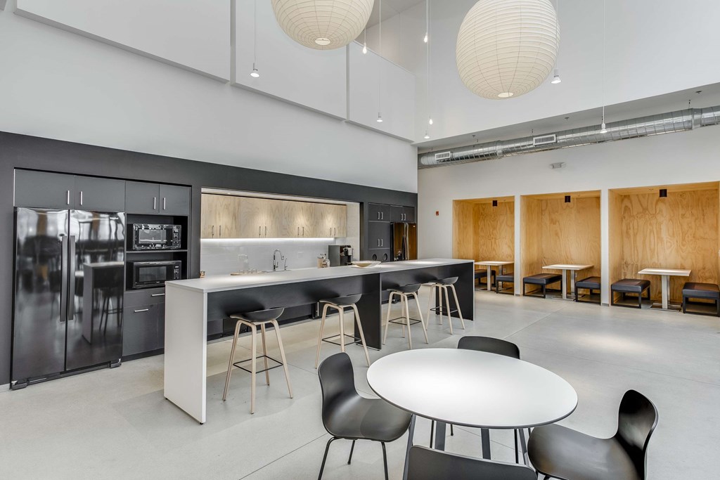 a large kitchen and dining room with a table and chairs