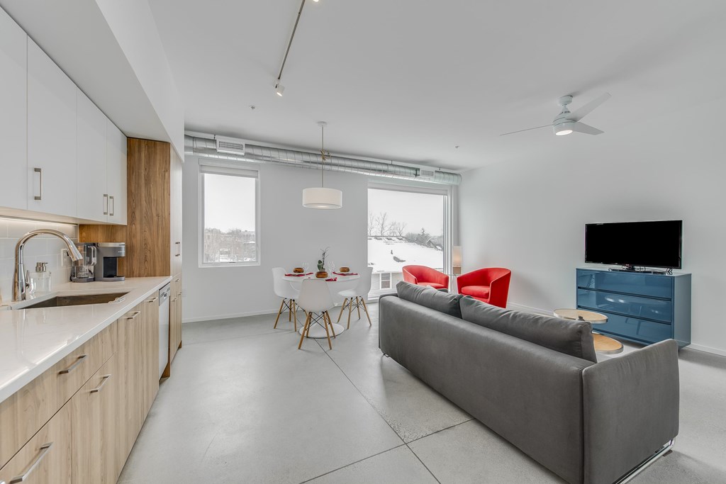 a living room with a couch and a table and a television