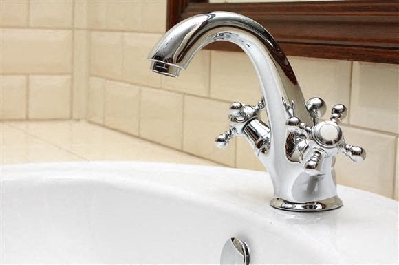 a bathroom sink with a chrome faucet