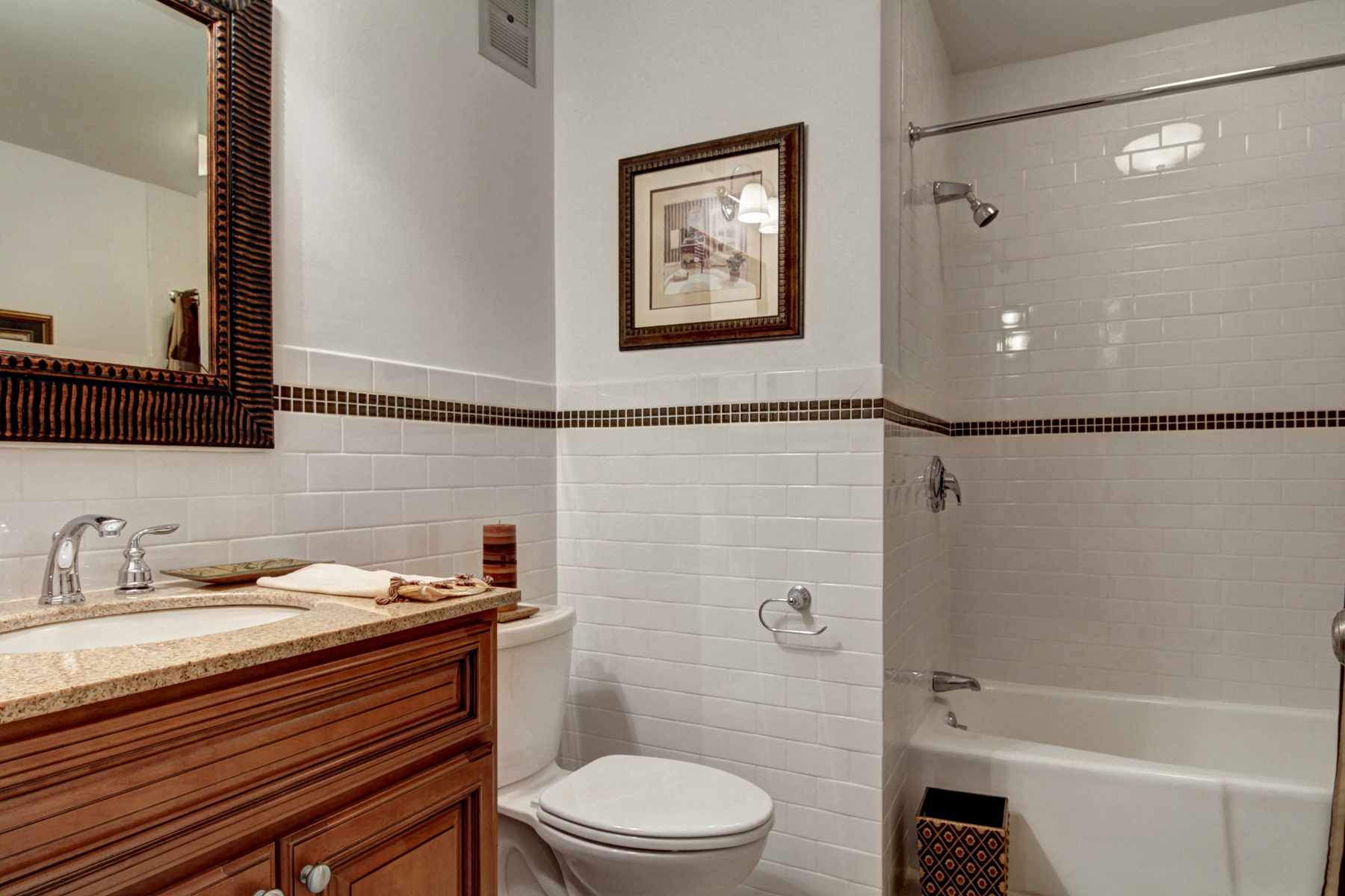 a bathroom with a toilet and a tub and a sink