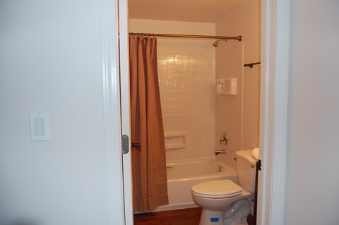 a small bathroom with a shower and a toilet