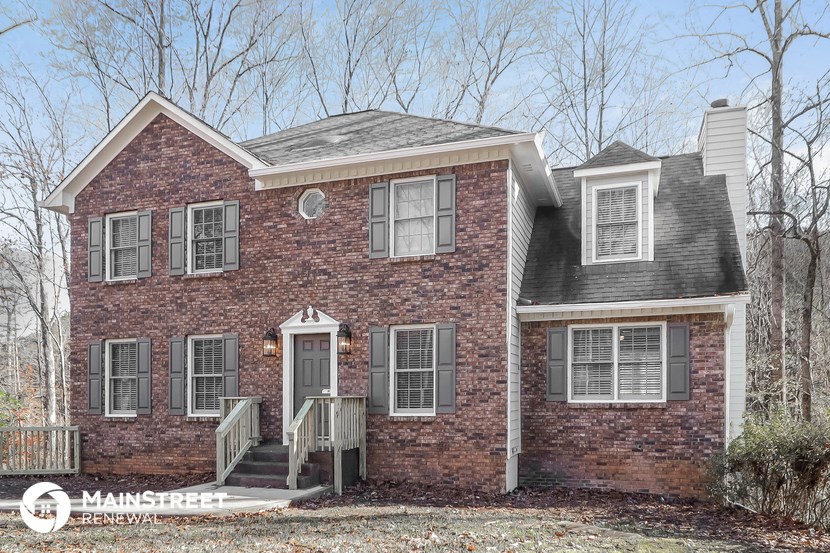 a brick house with a front porch and a