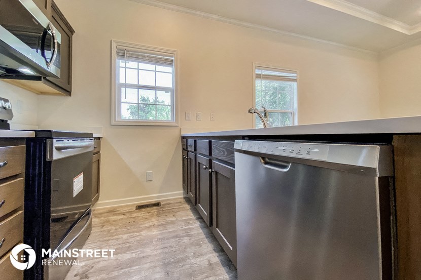 a kitchen with stainless steel appliances and a counter top