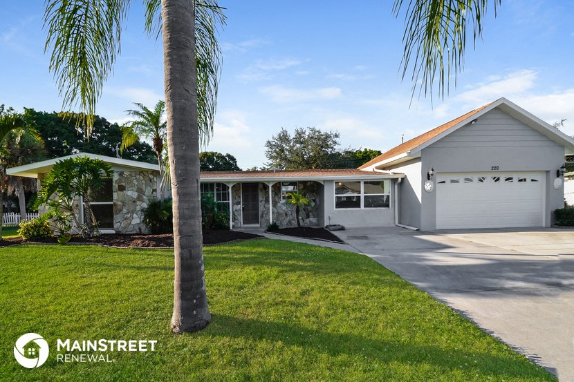 a house with a palm tree in front of it
