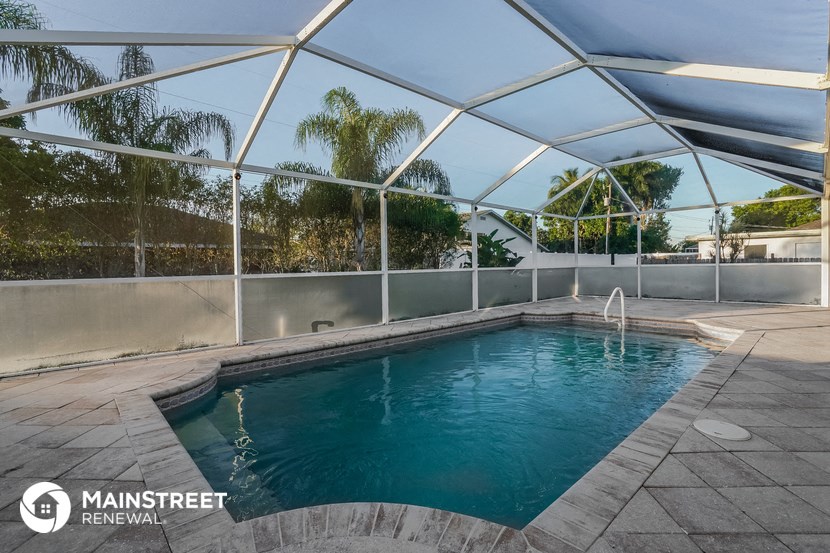 a swimming pool with a glass roof over it