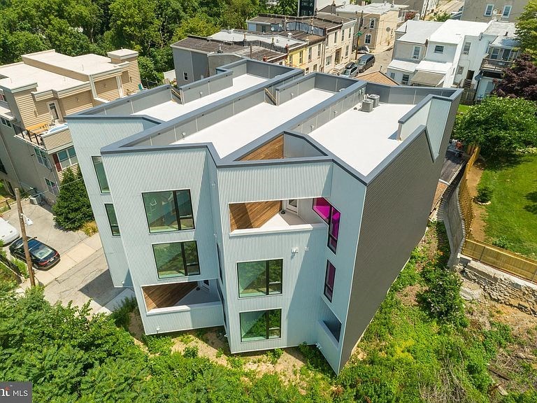 a view of a house from the roof of a city