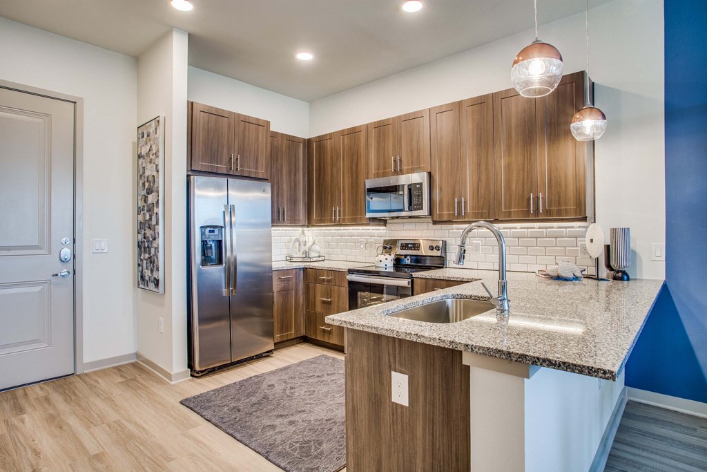 Westloop at the Diamond InterchangeWestloop at the Diamond Interchange Irving TX  modern kitchen with custom cabinetry and granite countertops