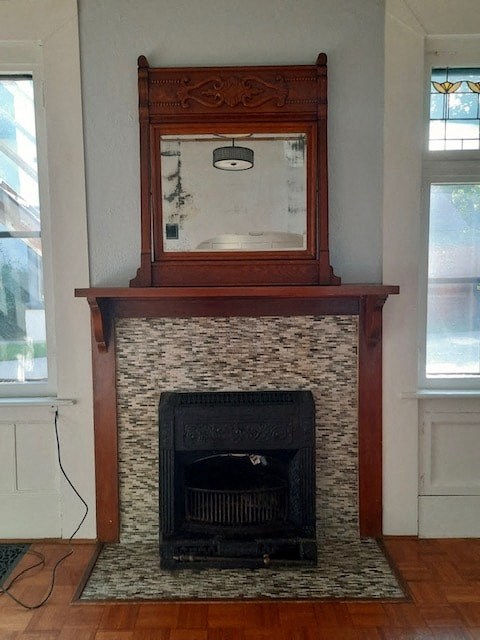 a fireplace with a mirror on top of it