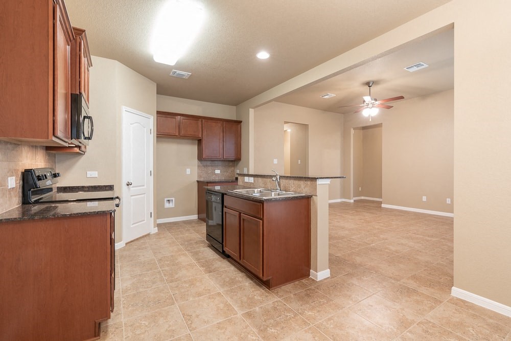 a kitchen with a counter top and a sink