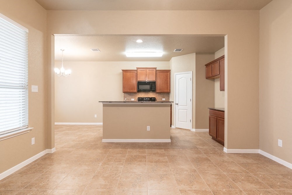 a kitchen with a counter top and a sink