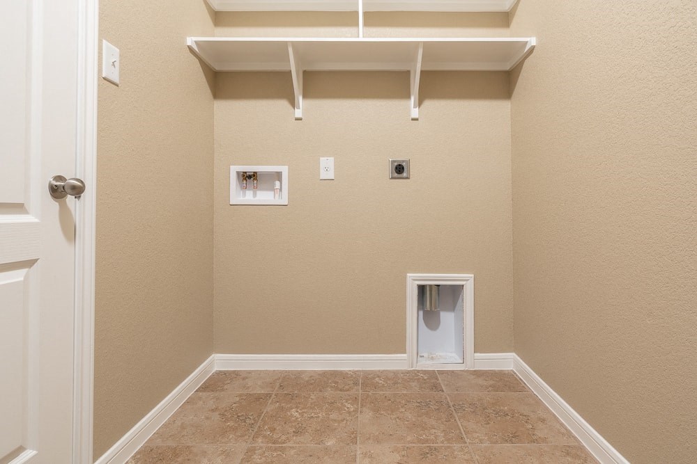 a empty room with a closet and a urinal on the floor