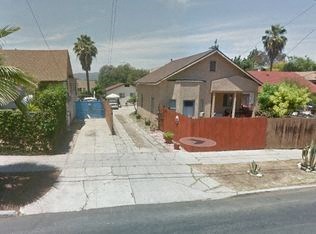 a house on the corner of a street