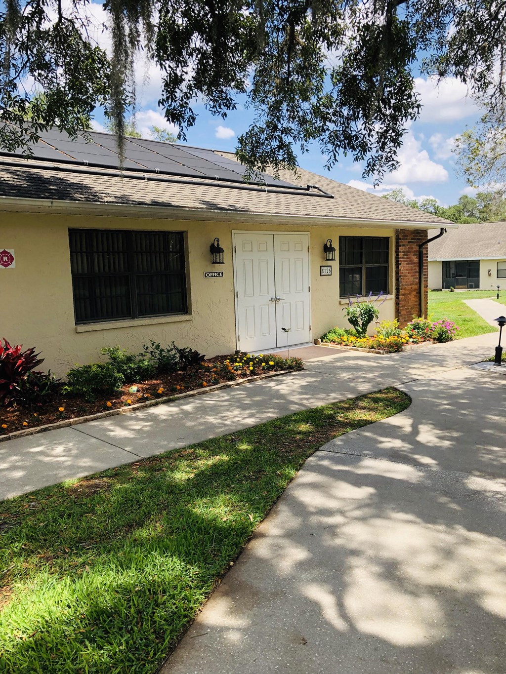 a house with a driveway and a white door