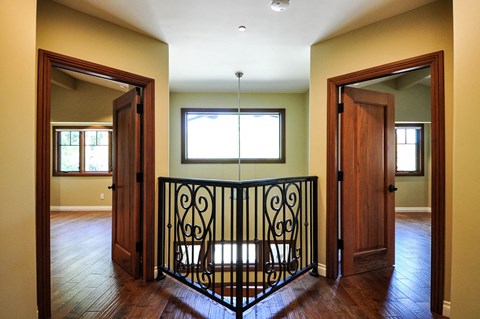 A room with a black iron gate in the middle.